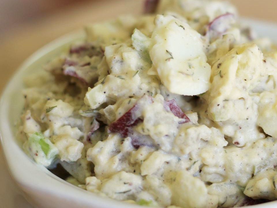 close up view of Southern Dill Potato Salad in a white bowl