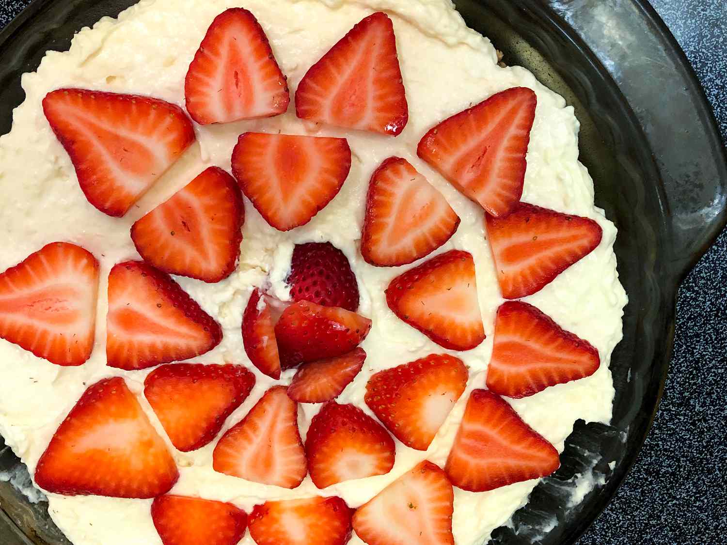 close up view of No Bake Sugar Free Strawberry Cheesecake in a baking dish