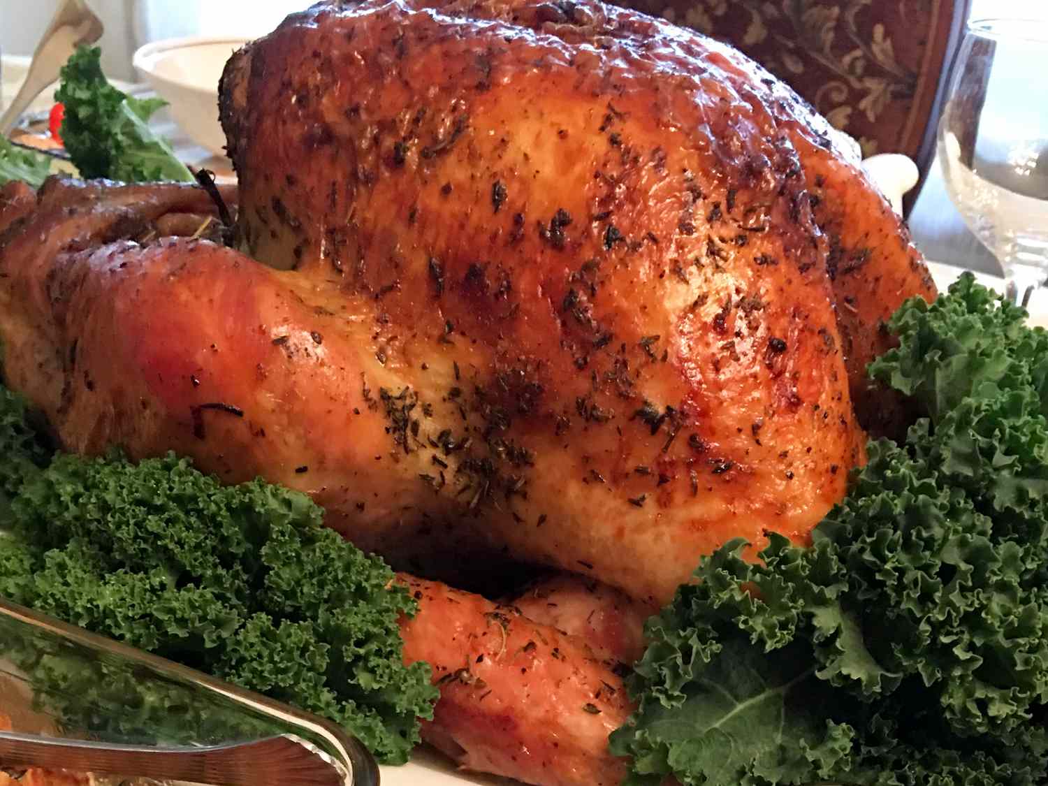 close up view of BBQ Turkey on a platter with kale