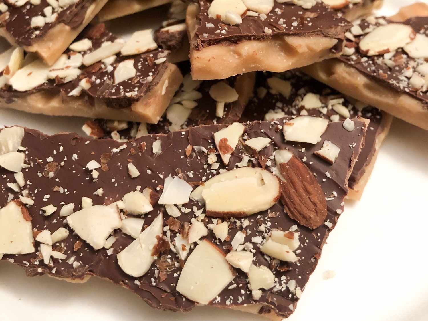 close up view of a pile of English Toffee with almonds