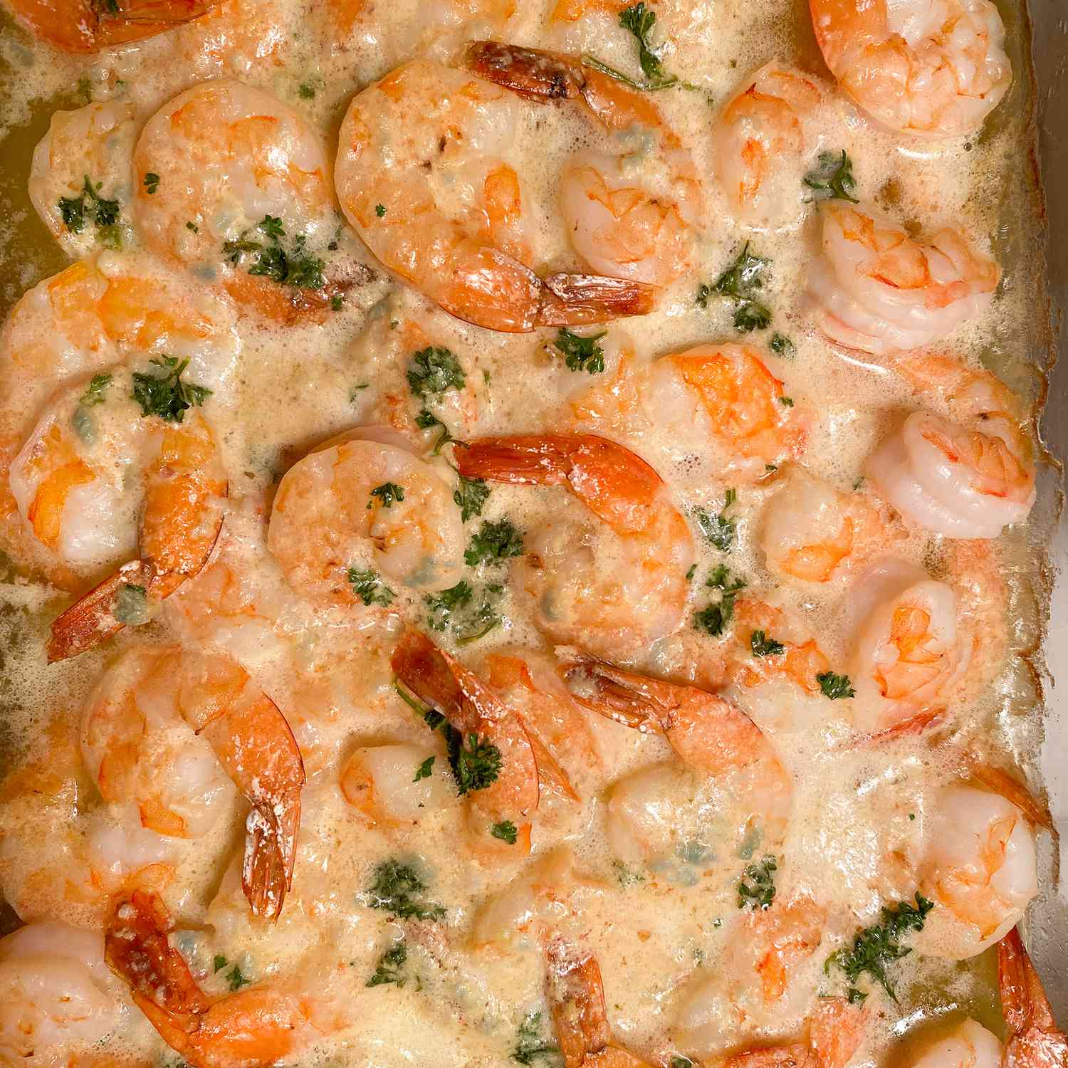 close up view of a Shrimp Scampi Bake in a baking dish