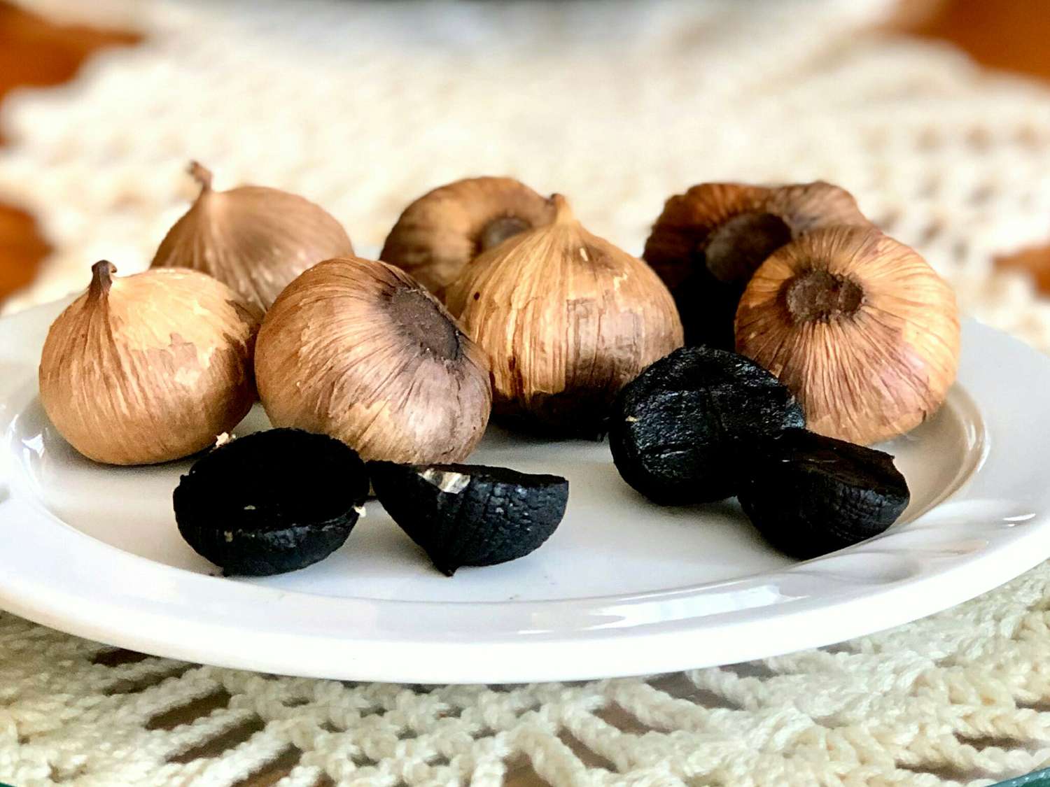 close up view of Black Garlic on a white plate