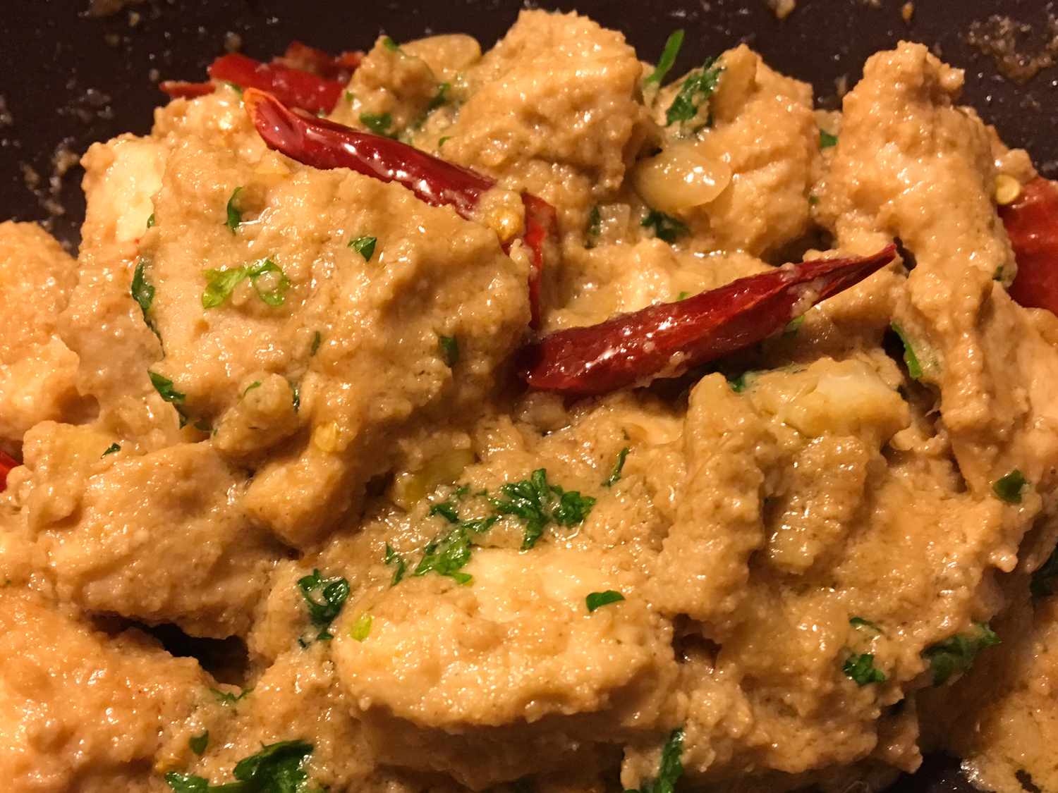 close up view of Tahini Chicken in a black pan