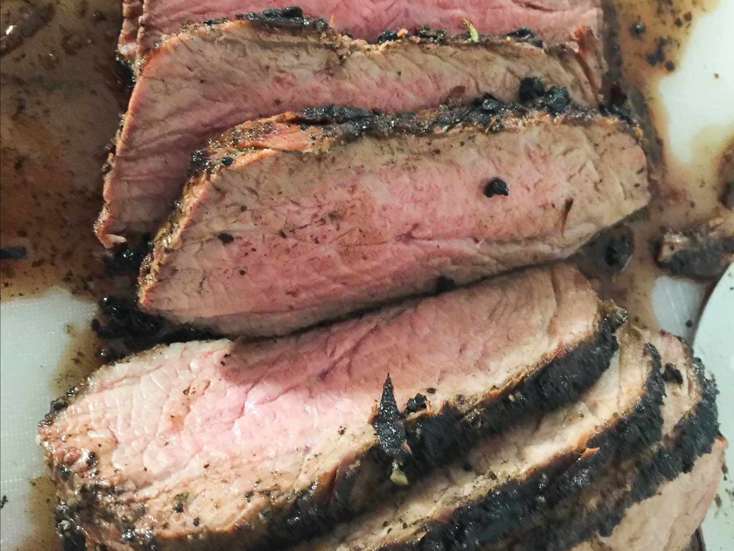 close up view of sliced Beef Loin Tri-Tip Roast on a platter