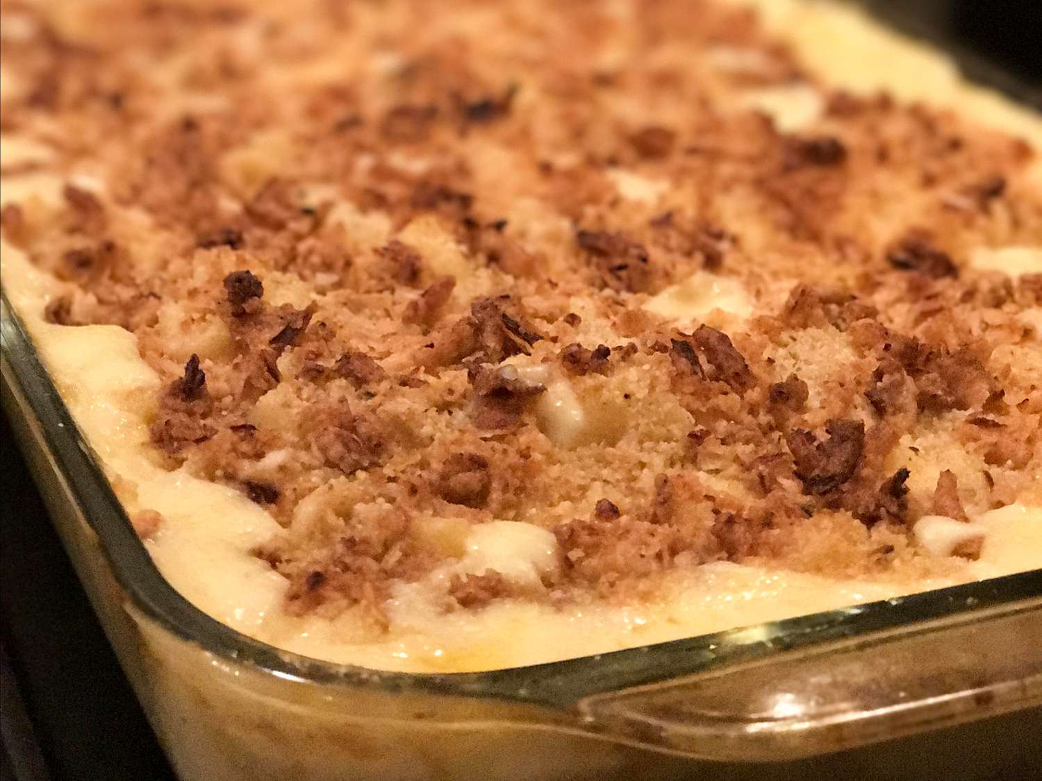 close up view of Four-Cheese Truffled Macaroni and Cheese in a glass baking dish