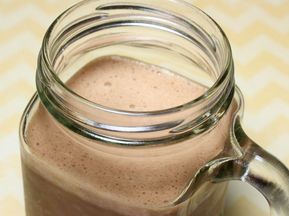 close up view of Healthy Cocoa, Banana, PB Smoothie in a jar