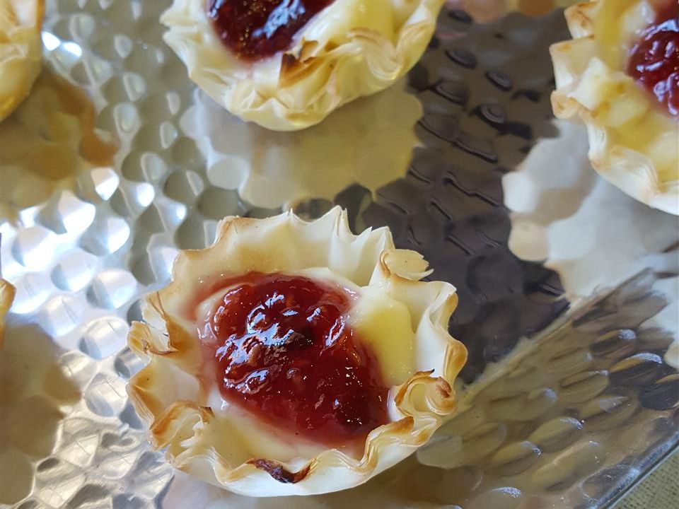 close up view of Brie Cups on a baking sheet
