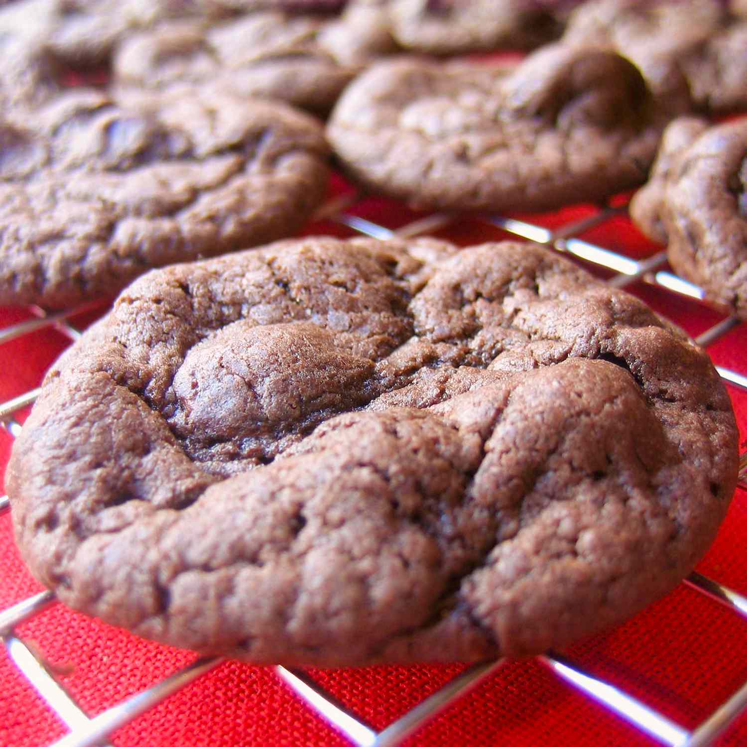 close up view of chocolate Cake Mix Cookies on a cooling rack