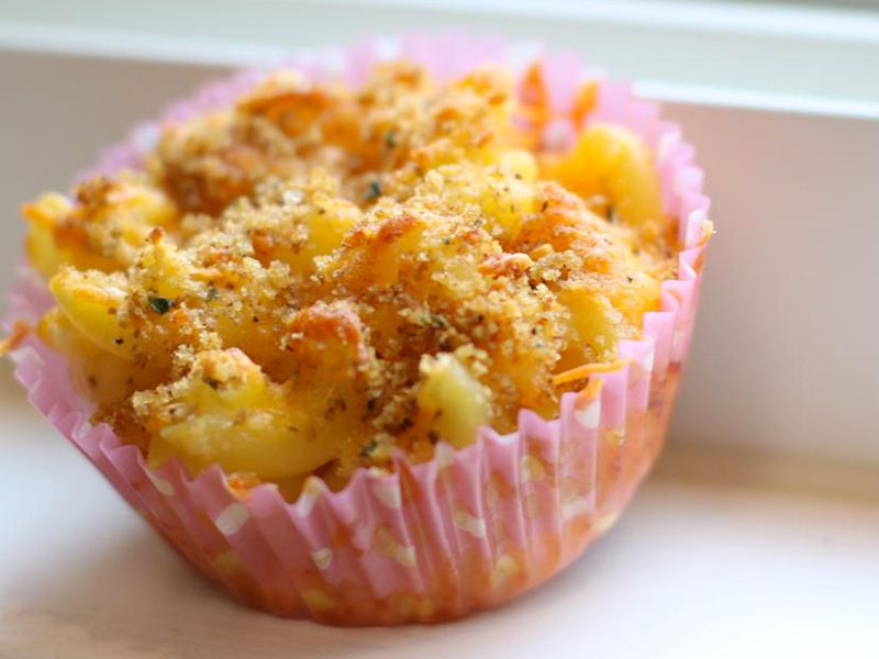 close up view of a Mac and Cheese Muffin in a pink muffin cup