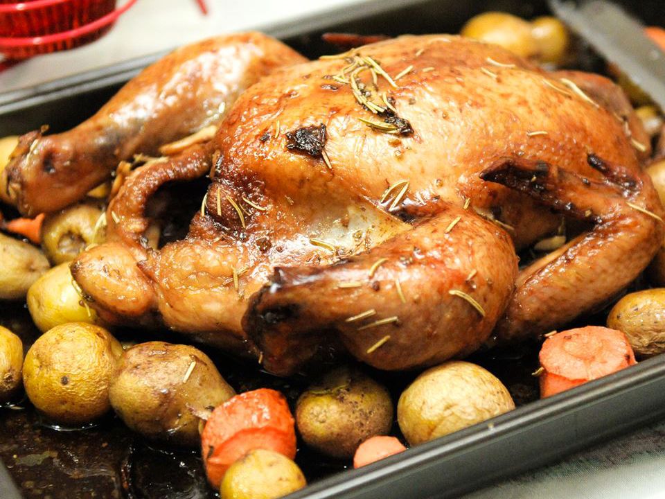 close up view of Roasted Herb Chicken and Potatoes in a baking pan