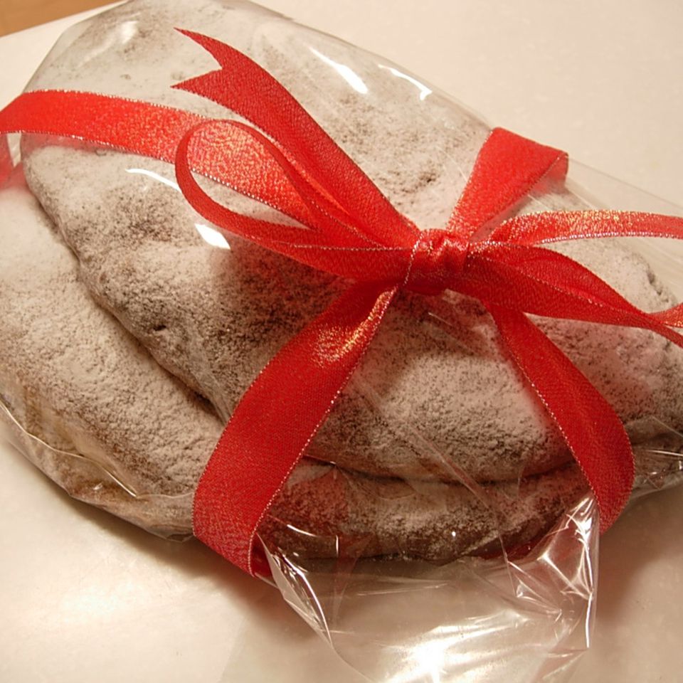 Christmas stollen in clear wrap with red ribbon