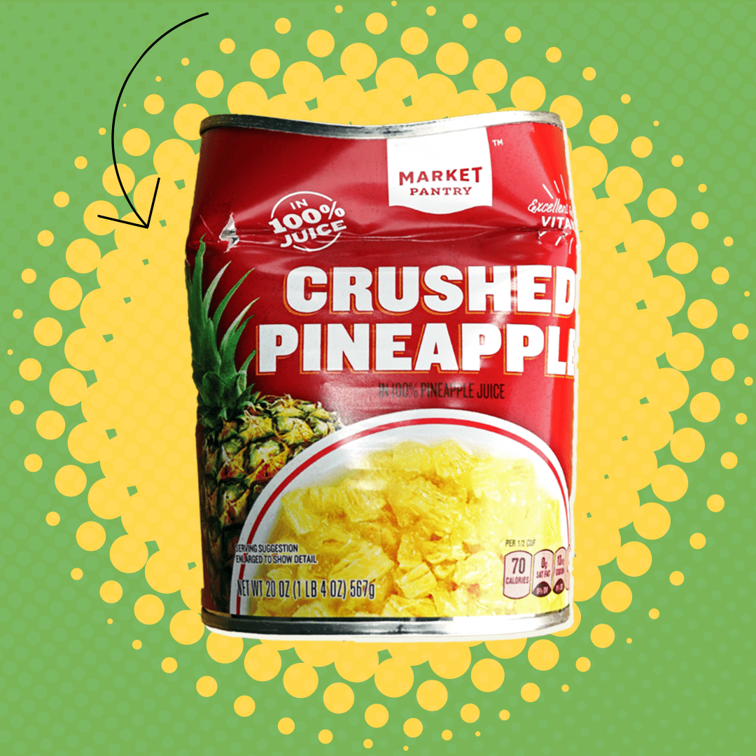 A dented can of crushed pineapple