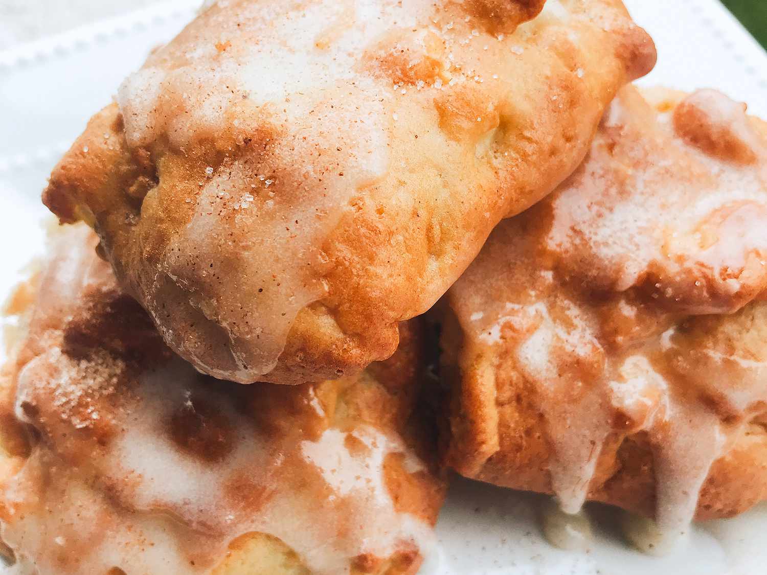 close up view of Air Fryer Apple Fritters on a white plate