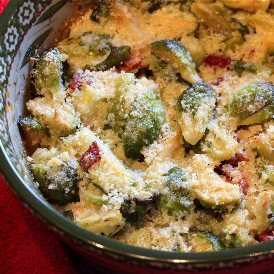 close up view of Brussels Sprouts Gratin in a bowl with cheese