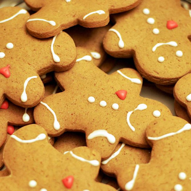 close up view of Gingerbread Cookies shaped as gingerbread men decorated with icing