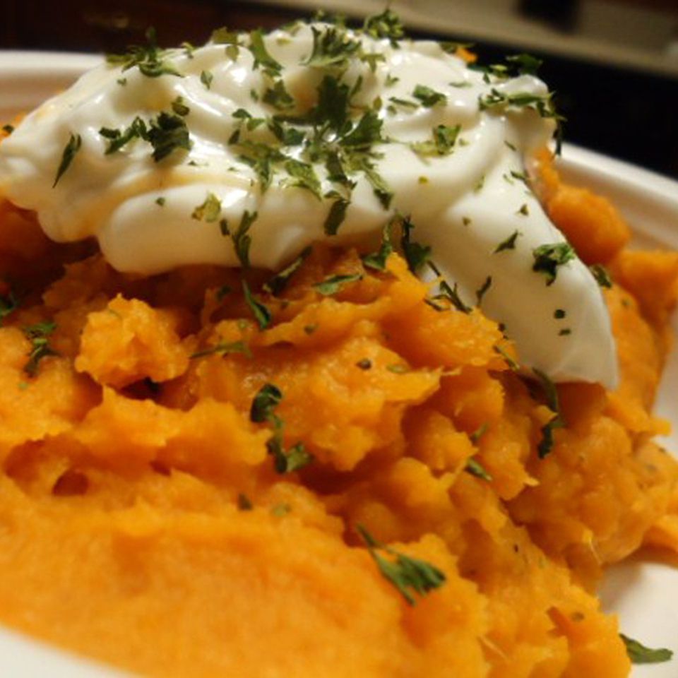 closeup of mashed sweet potatoes piled in serving bowl