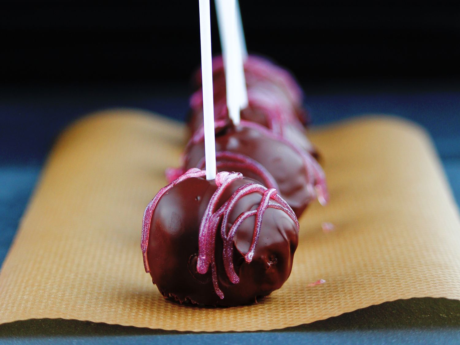 close up view Easy Cake Pops on top of parchment paper