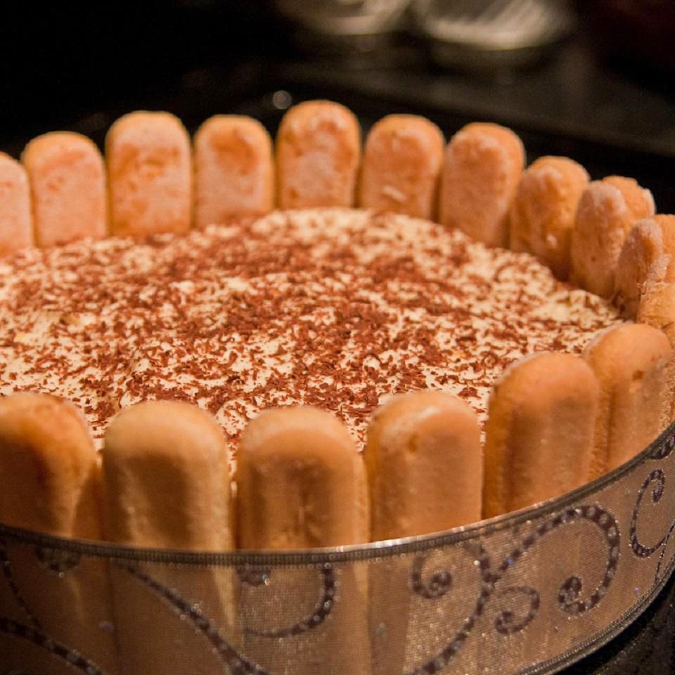 close up view of Classic Tiramisu garnished with shave chocolate in a decorative bowl