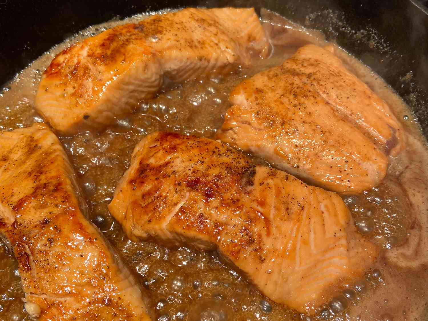 close up view of Salmon with Brown Sugar and Bourbon Glaze in a pan