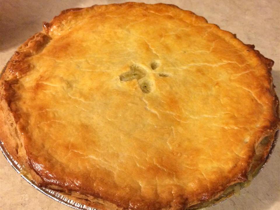 close up view of a Steak Pie in a foil pan