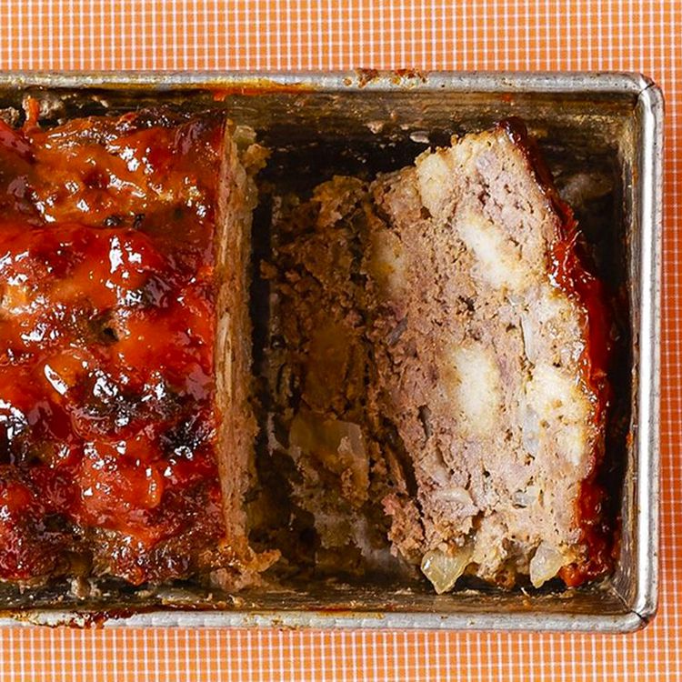close up view of sliced Meatloaf in a loaf pan