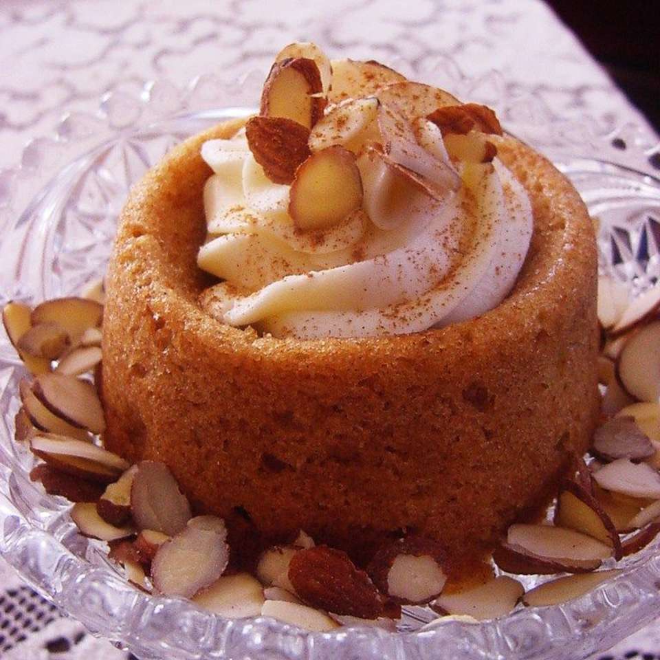 individual Jewish Apple Cake II with whipped cream and slivered almonds