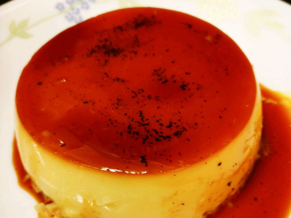 close up view of Caramel Custard on a floral white plate