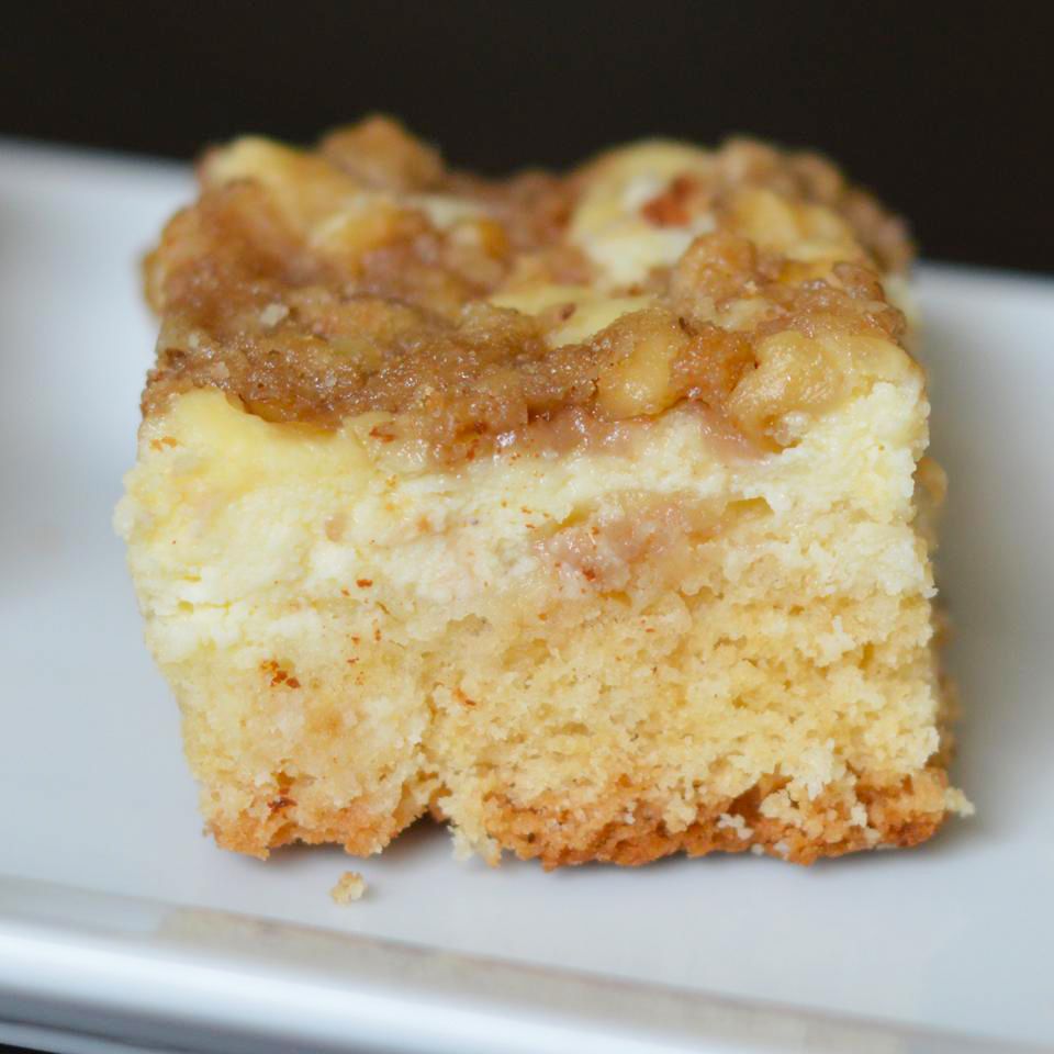 close up view of a slice of Polish Cream Cheese Coffee Cake on a white plate