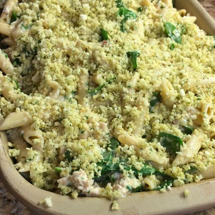 close up view of Pesto Chicken Penne Casserole in a baking dish