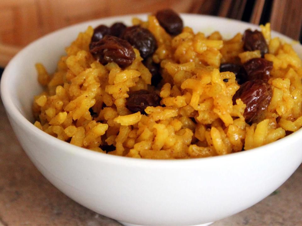 close up view of South African Yellow Rice in a white bowl