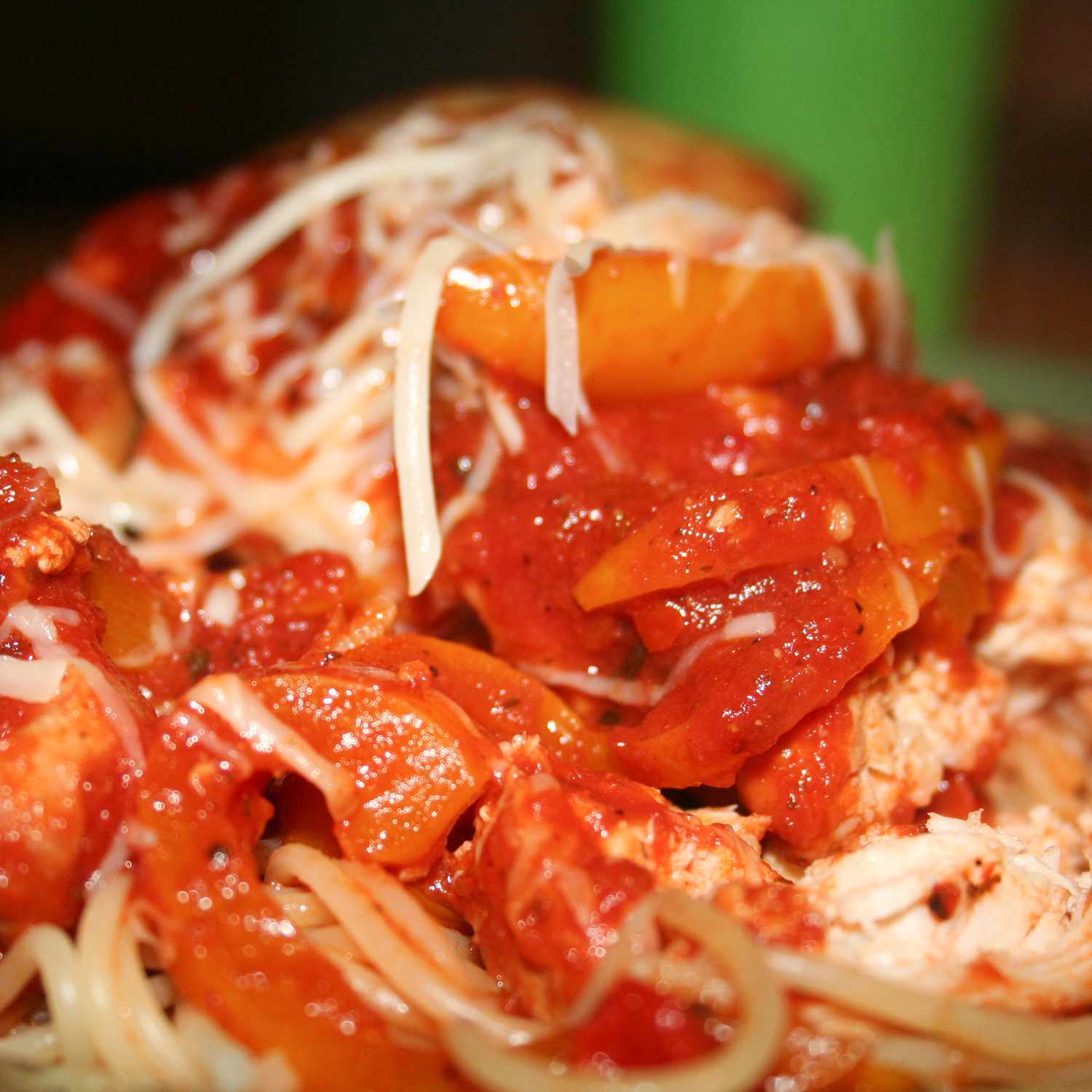 close up view of Slow Cooker Chicken Cacciatore garnished with cheese