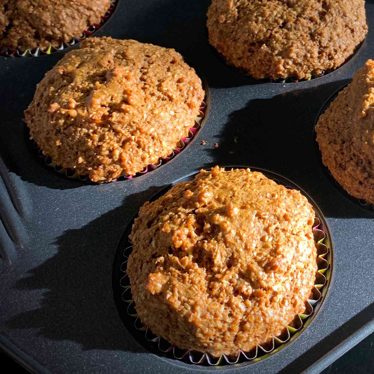 freshly baked bran muffins in a muffin pan