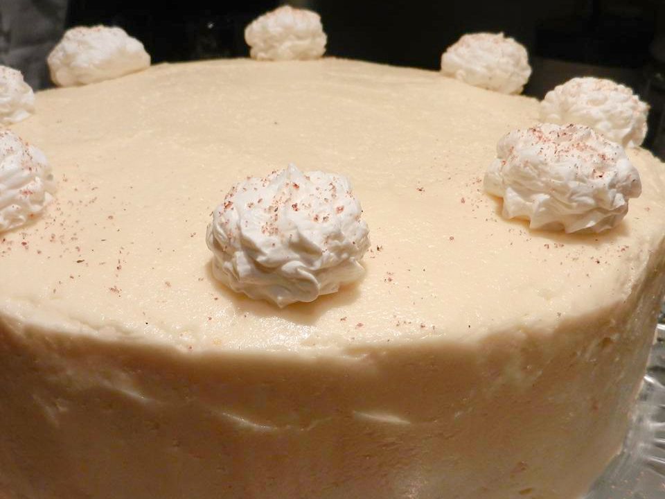 close up view of Eggnog Cake garnished with white icing