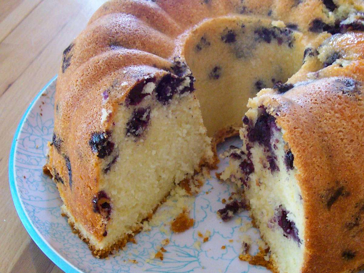close up view of a sliced Blueberry-Lemon Pound Cake
