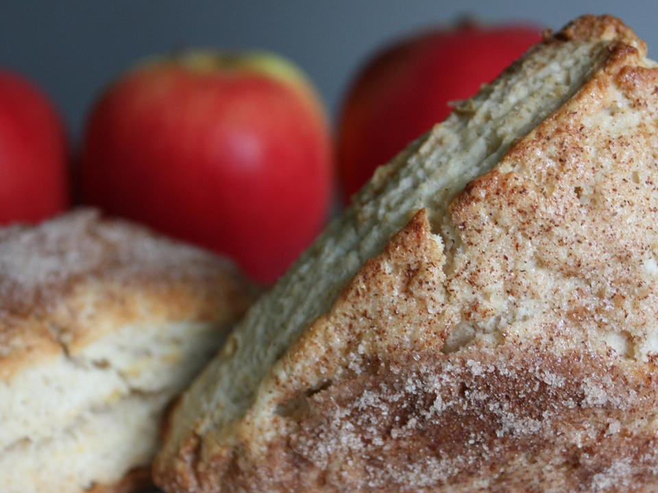 close up view of Apple Scones with apples in the background