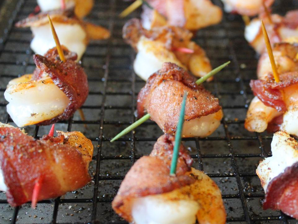 close up view of Bacon Wrapped Barbeque Shrimp on a cooling rack
