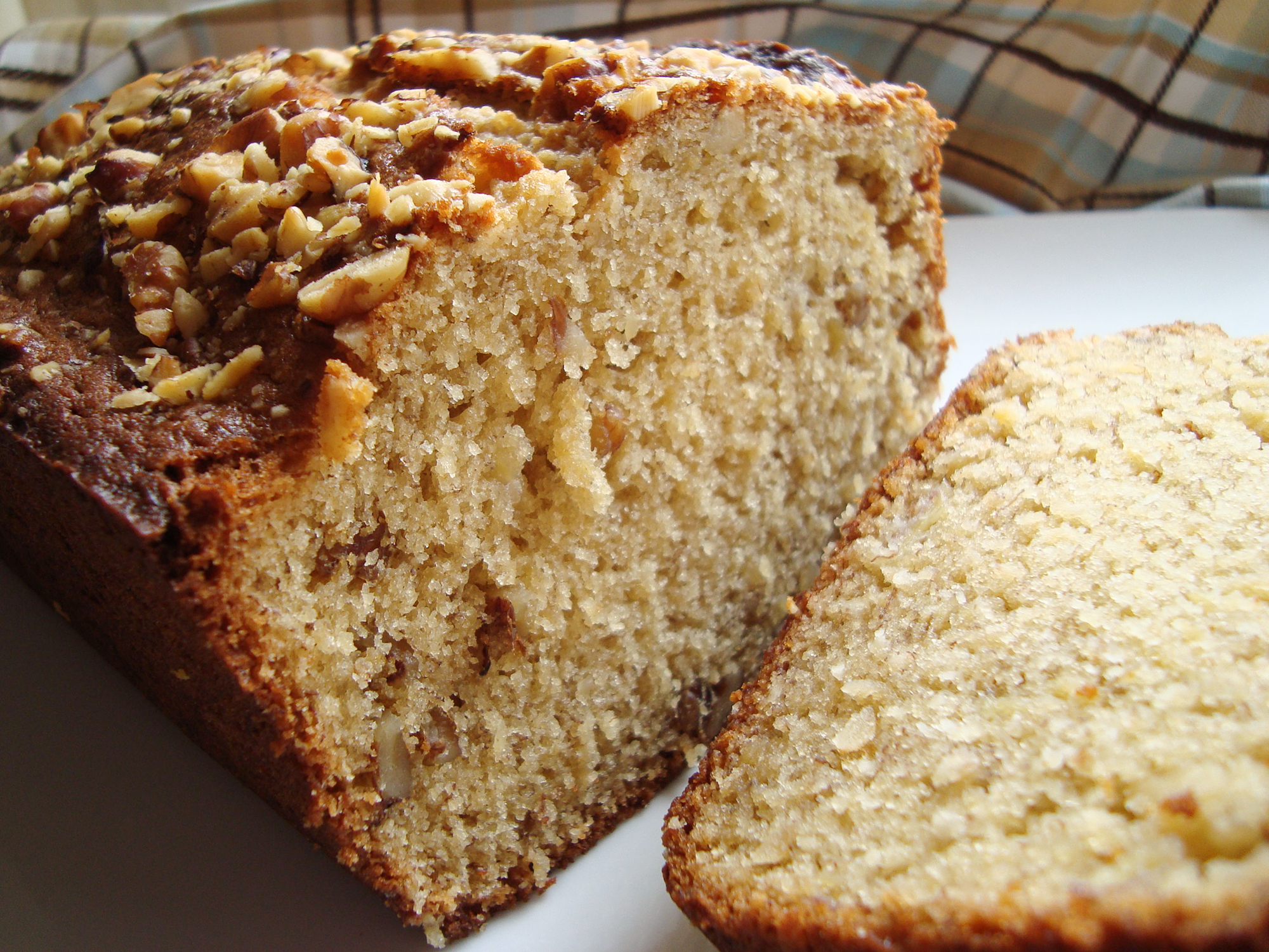 close up view of a sliced Brown Sugar Banana Nut Bread on a plate