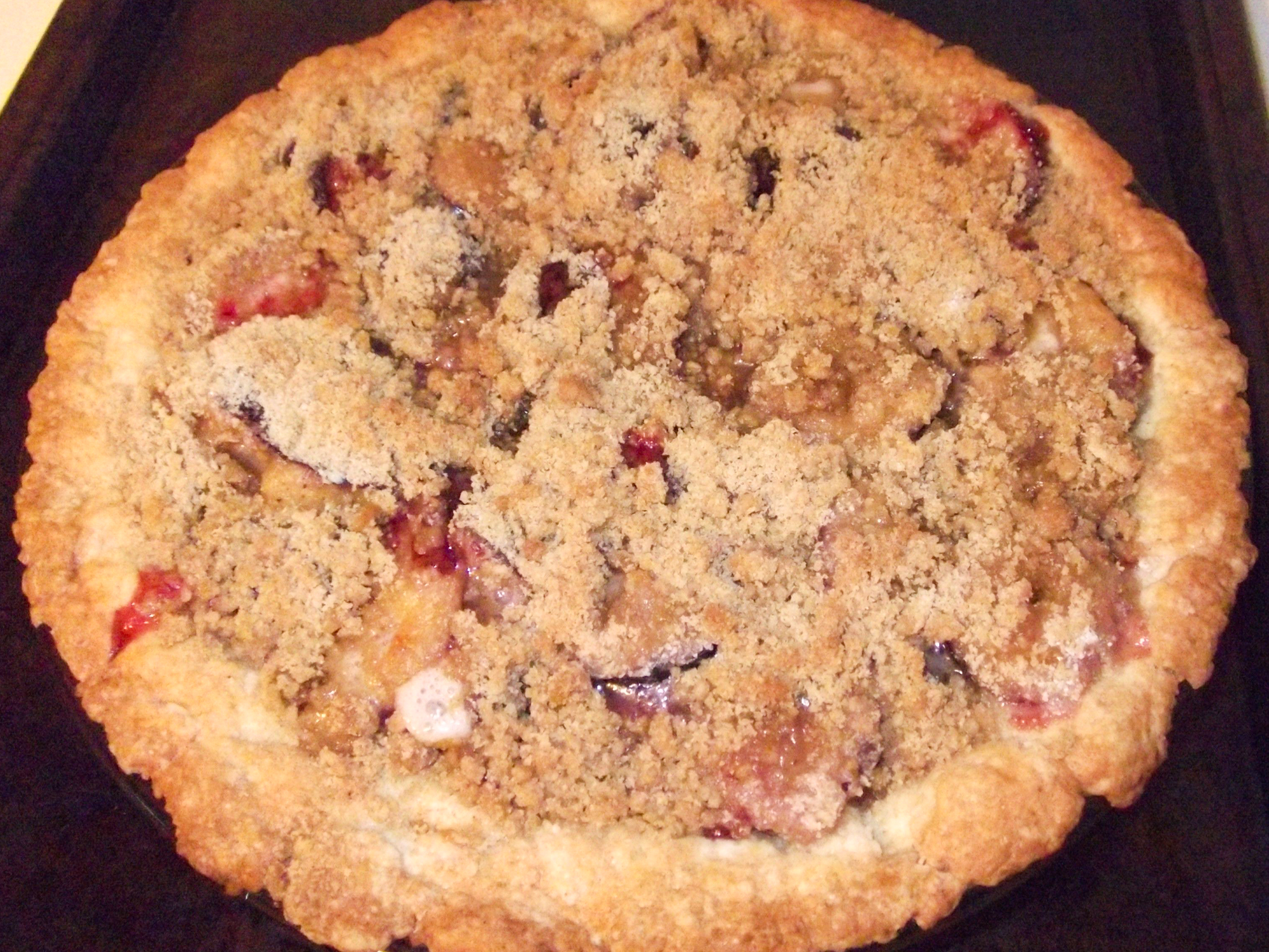close up view of Plum Pie in a pie pan
