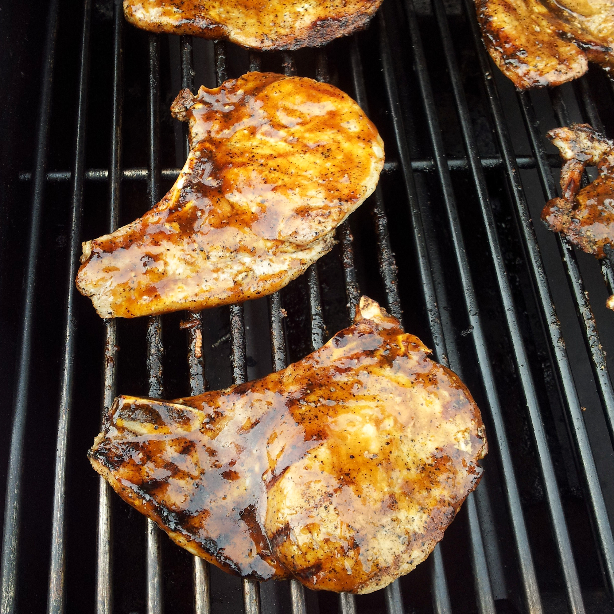 close up view of Grilled Brown Sugar Pork Chops on a grill