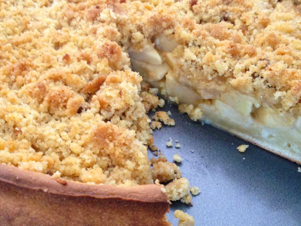 close up view of a Apfelkuchen (Apple Cake) with a slice missing