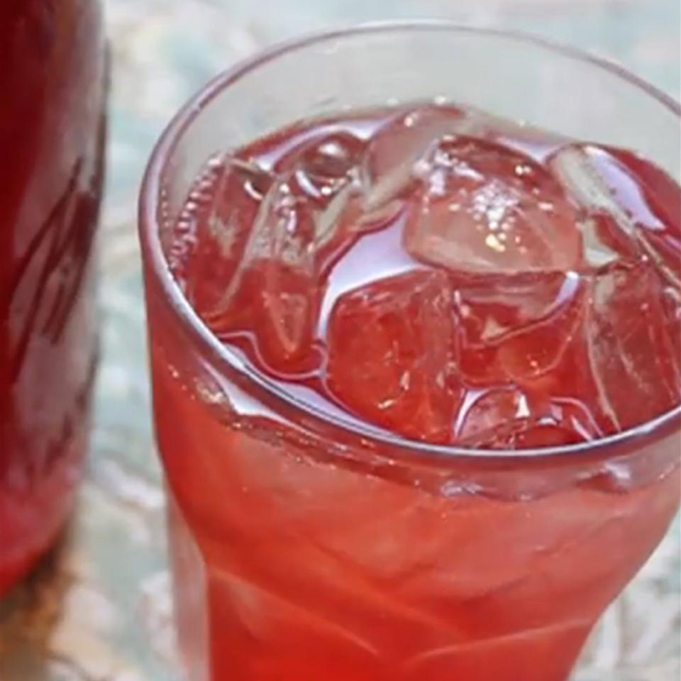close up view of red soda with Strawberry Soda Syrup in a glass