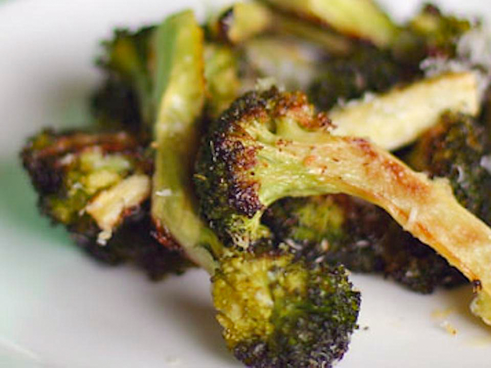 close up view of Oven-Roasted Broccoli on a white plate