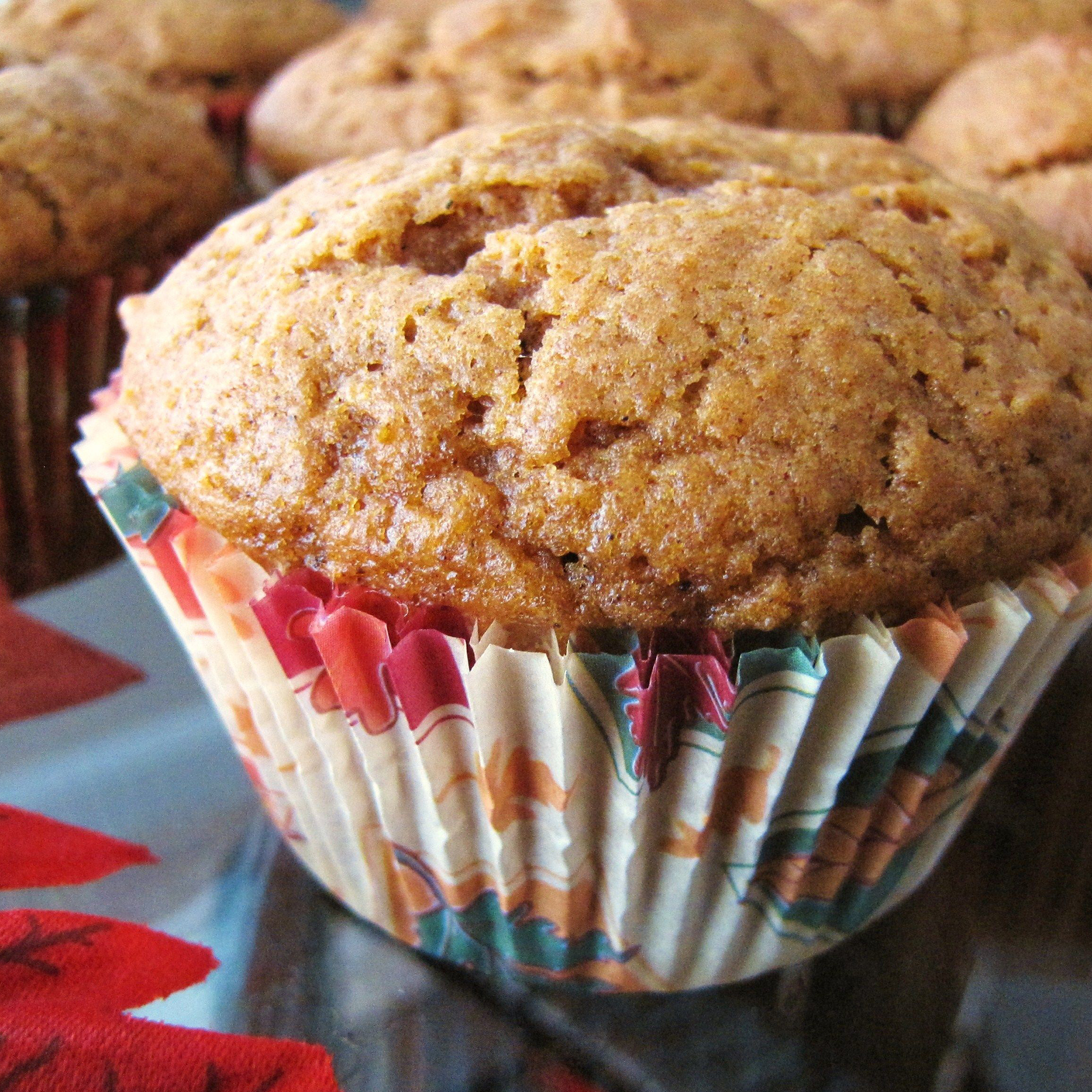 close up view of Pumpkin Muffins in colorful muffin liners