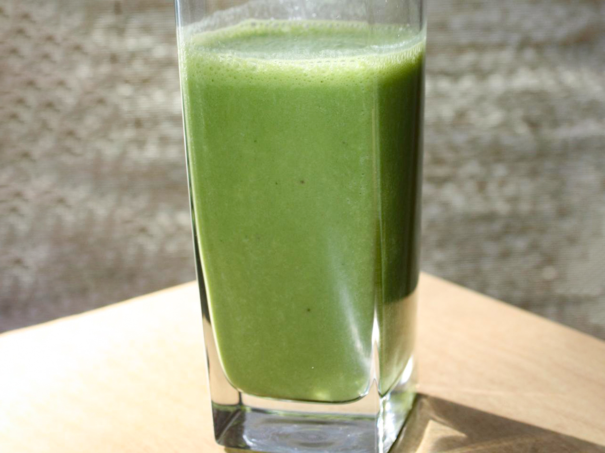 close up view of a Breakfast Banana Green Smoothie in a glass