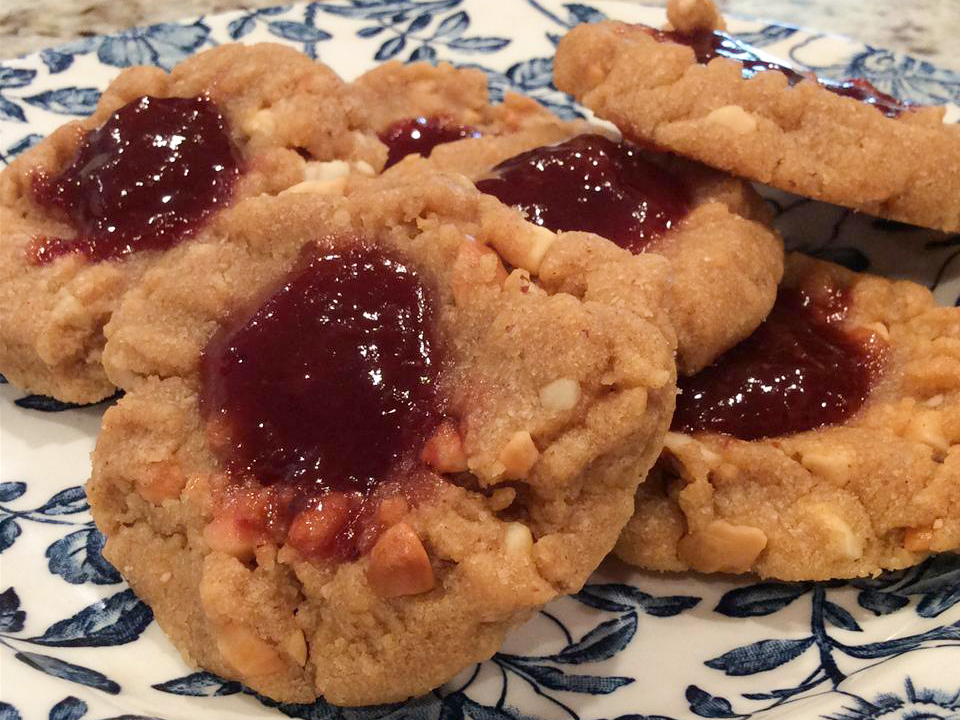 close up view of a pile of Peanut Butter and Jelly Cookies on a plate