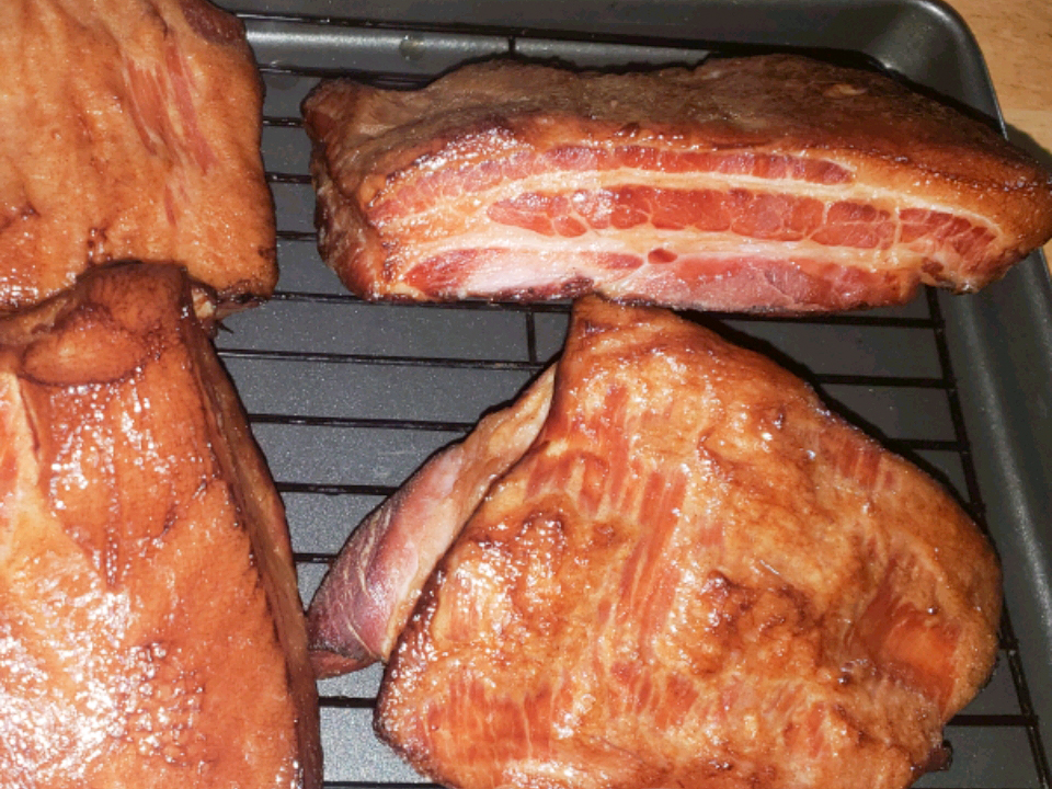 close up view of Smoked Maple Syrup Bacon on a cooling rack