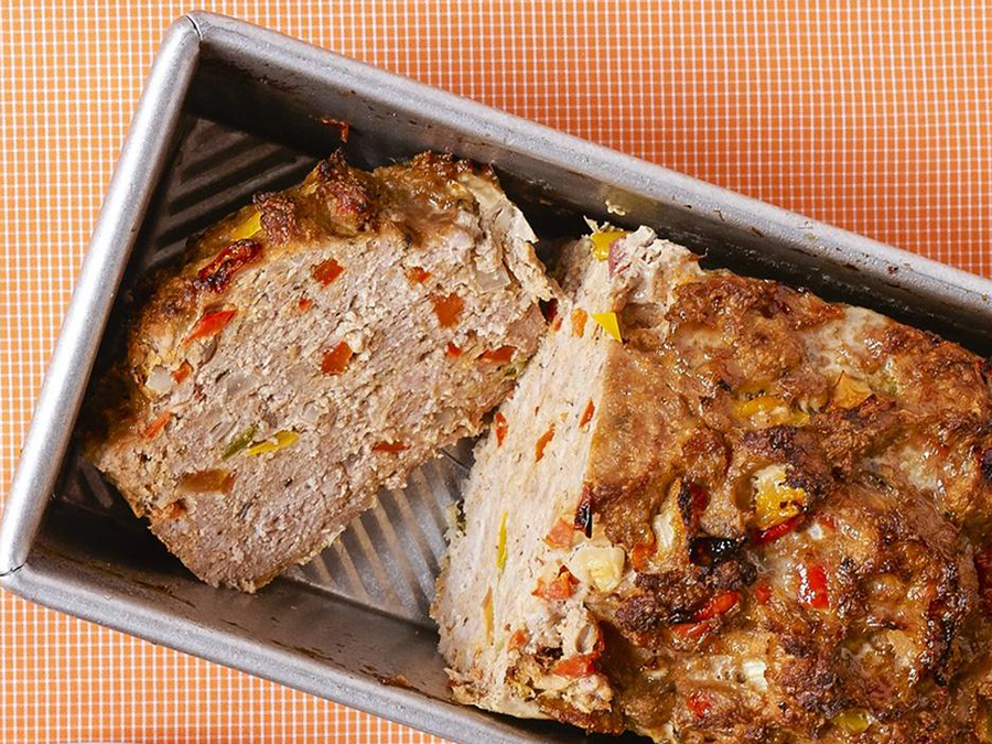 close up view of a sliced Turkey Loaf in a baking dish