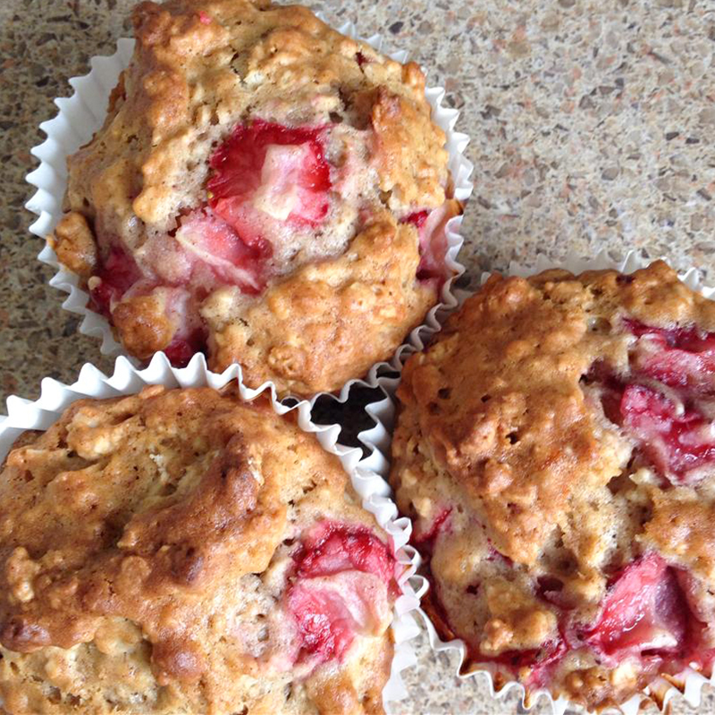 close up view of Strawberry Cinnamon Oatmeal Muffins in muffin liners