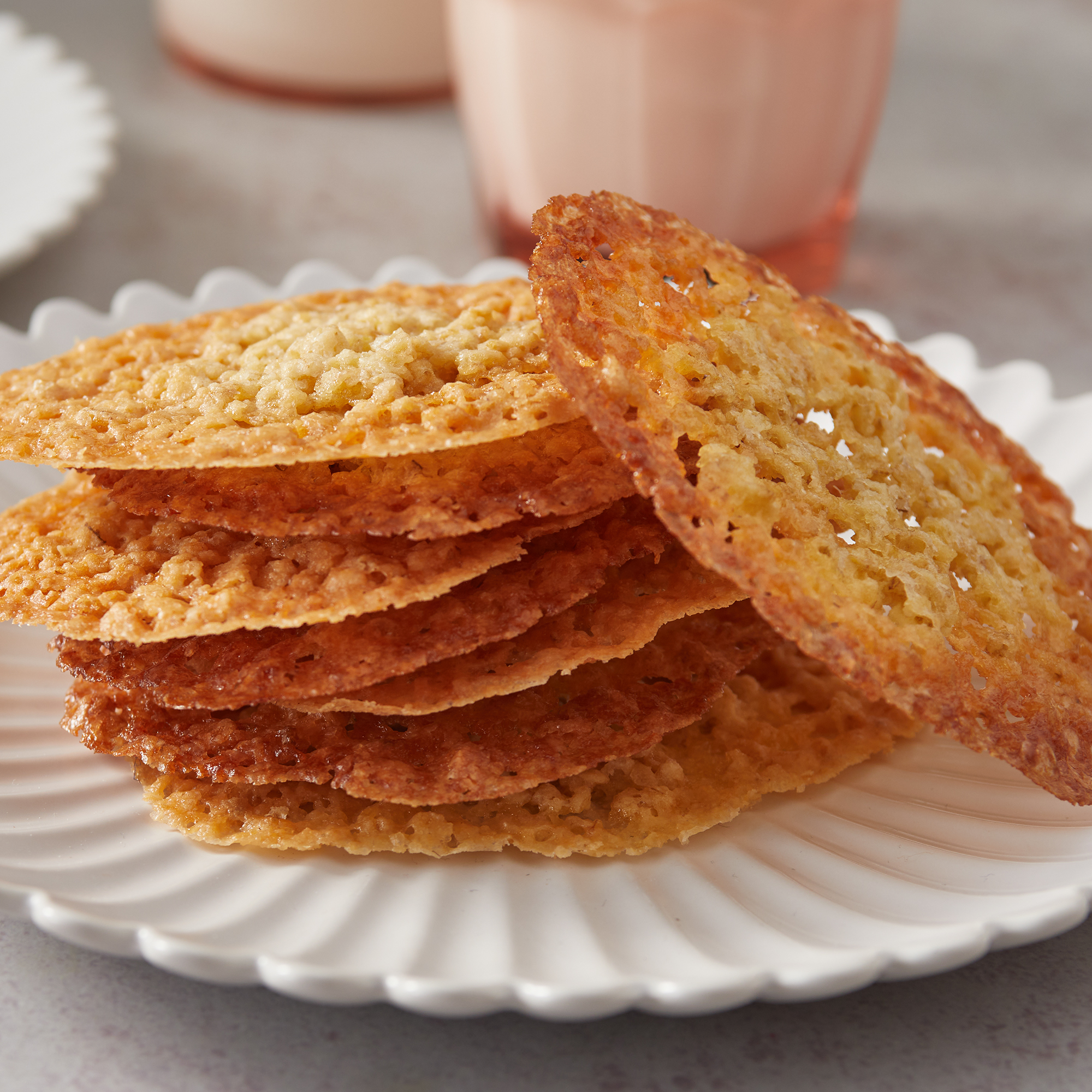close up on a stack of golden brown lace cookies