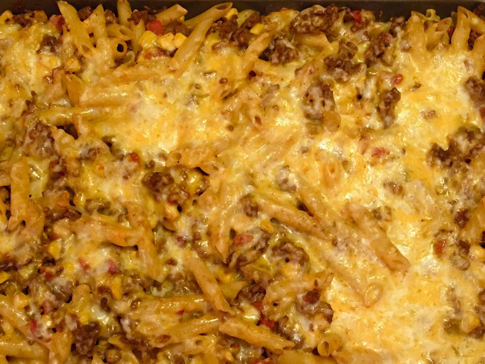 close up view of a Chili Casserole with melted cheese in a baking dish